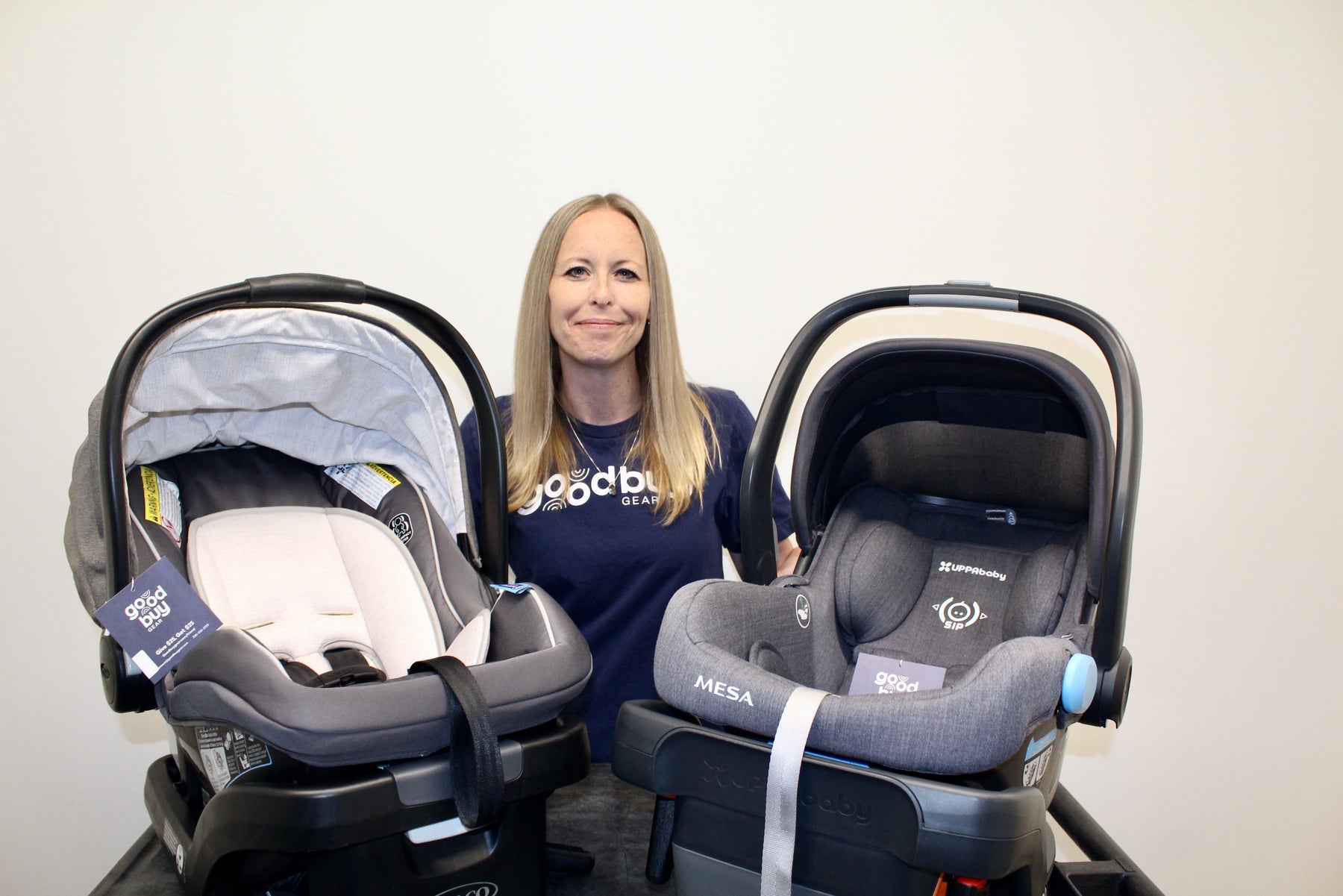 Amanda, Goodbuygears's In-House CPST holding two car seats
