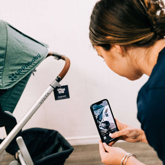 Goodbuygears employee quality checking a secondhand UPPAbaby strollers
