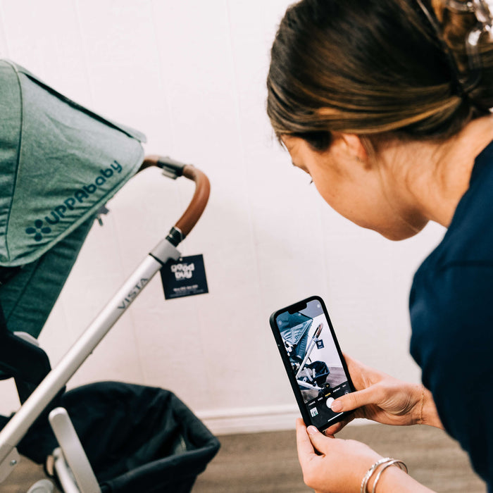 Goodbuygears employee quality checking a secondhand UPPAbaby strollers