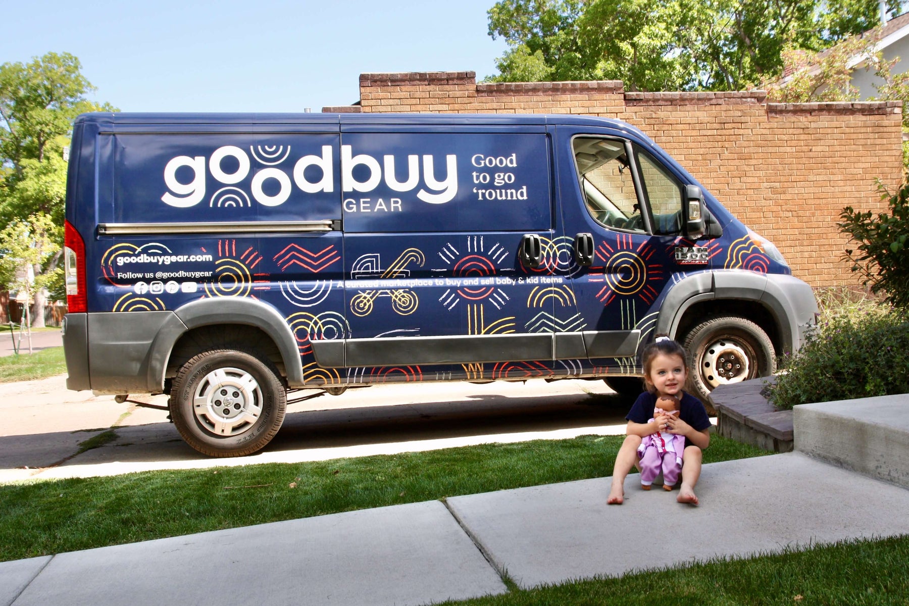 Goodbuygears Van outside of a house picking up gently used baby gear