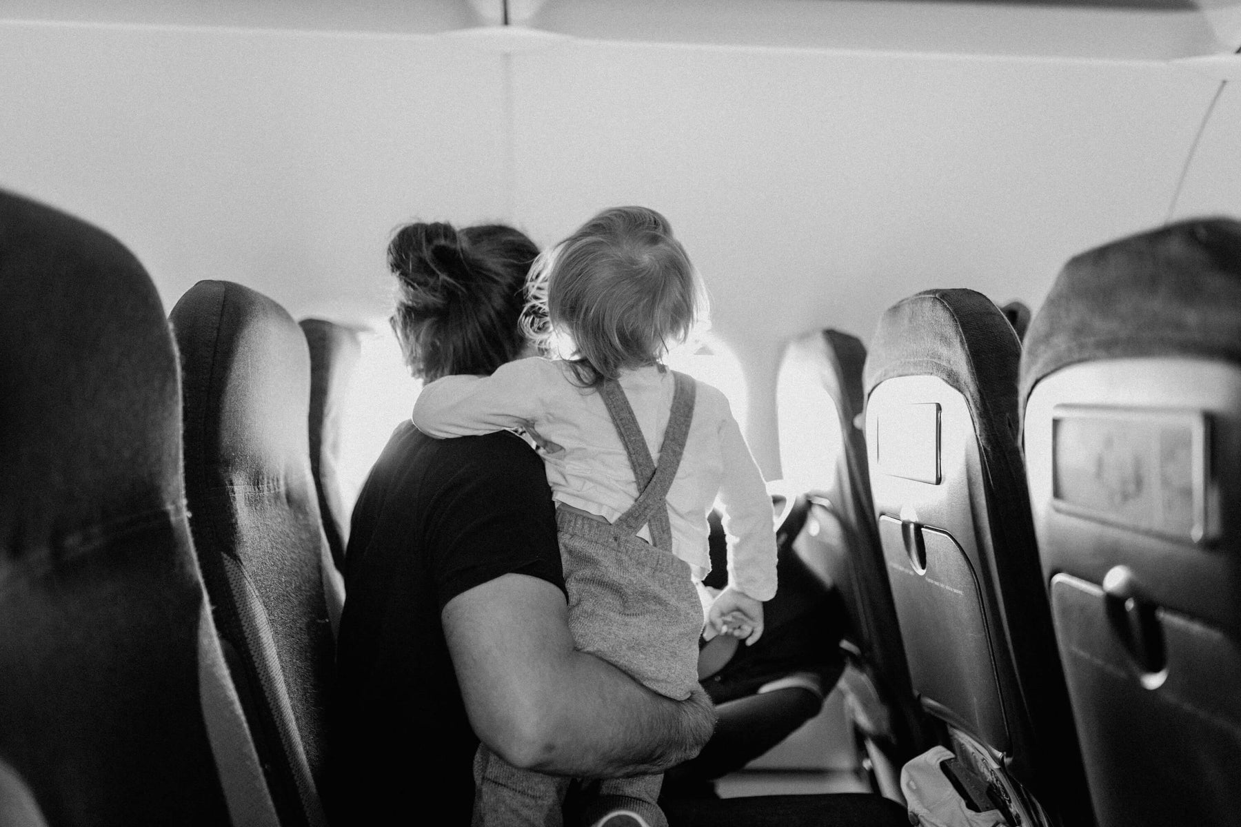 Mom with her toddler on an airplane
