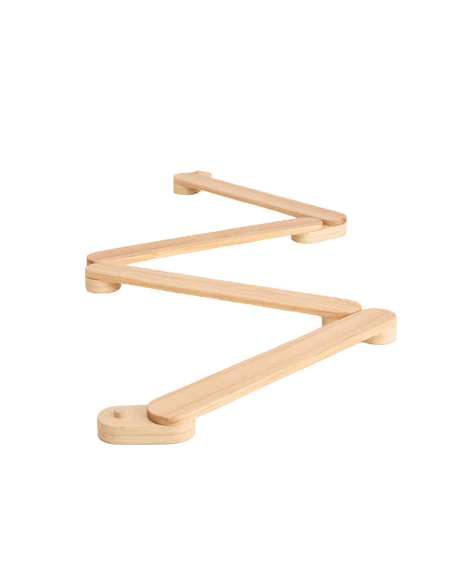 A wooden Piccalio Acrobat Balance Beam laid out on a white background.
