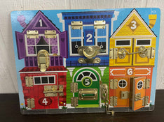 used Melissa & Doug Latches Board