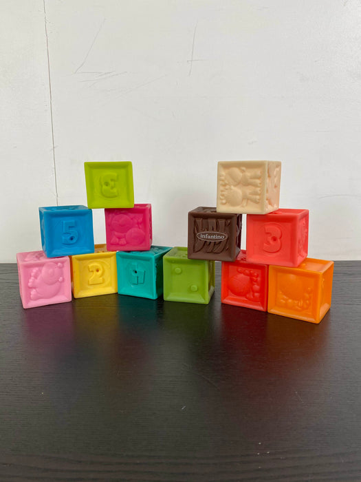used Infantino Squeeze & Stack Block Set