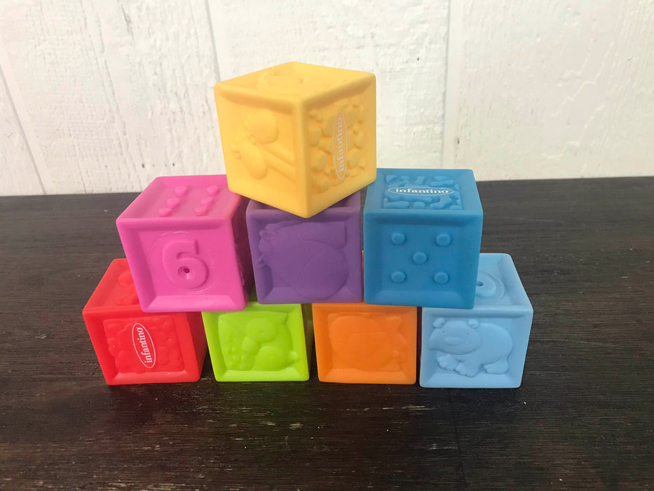 used Infantino Squeeze & Stack Block Set
